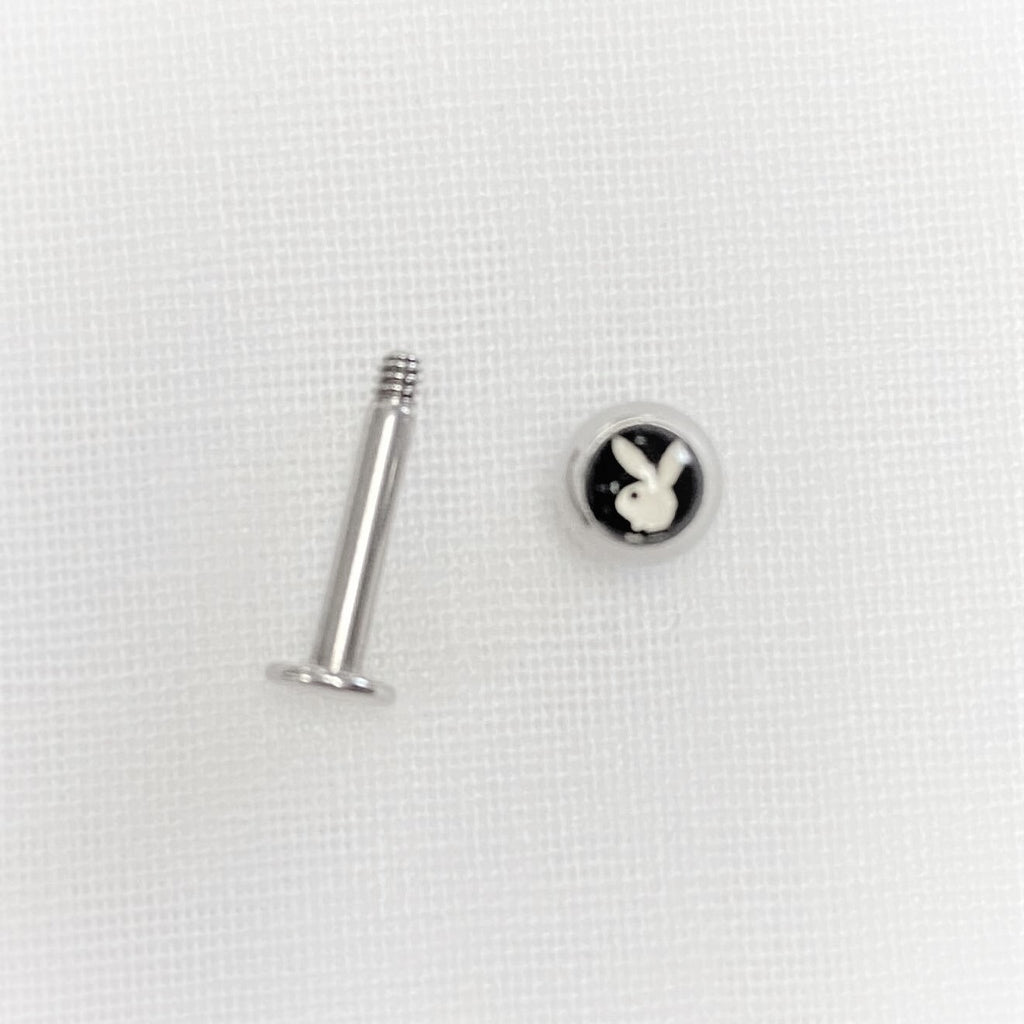 Chrome Playboy Tongue Piercing